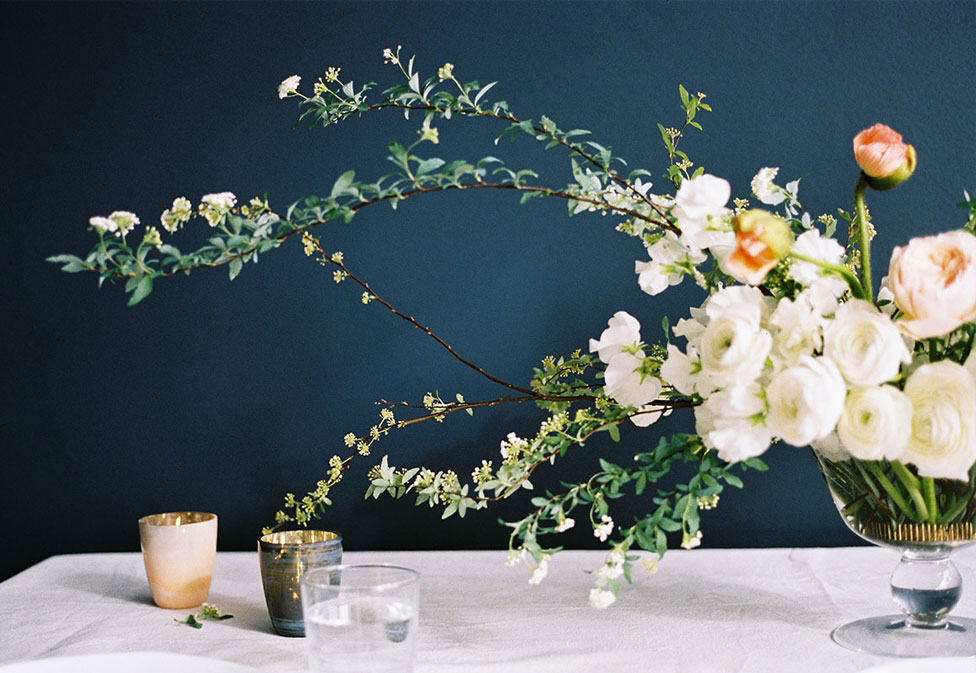 An organic wedding floral display with organic shapes and greenery